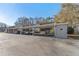 View of the covered carport parking area for residents, offering protection from the elements at 12155 Environmental Dr # 8, New Port Richey, FL 34654