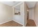 Dining room features laminate flooring and a view into the kitchen at 12155 Environmental Dr # 8, New Port Richey, FL 34654