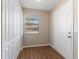 Inviting entryway featuring laminate floors, natural light and closet at 12155 Environmental Dr # 8, New Port Richey, FL 34654