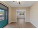 A spacious living room with wood floors provides an opening into a sunroom at 12155 Environmental Dr # 8, New Port Richey, FL 34654