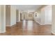 Bright living room boasting laminate flooring, large windows, and a ceiling fan at 12155 Environmental Dr # 8, New Port Richey, FL 34654