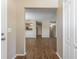 Open-concept living area featuring laminate flooring, and access to the kitchen at 12155 Environmental Dr # 8, New Port Richey, FL 34654