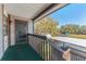 An elevated porch is accessible via stairs and offers scenic outdoor views at 12155 Environmental Dr # 8, New Port Richey, FL 34654