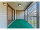 An outdoor porch with sliding glass doors provides an extended space for relaxation and views at 12155 Environmental Dr # 8, New Port Richey, FL 34654