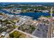 Aerial view of a coastal community with shops, restaurants, a marina, and waterways, showcasing a vibrant waterfront lifestyle at 124 Athens St, Tarpon Springs, FL 34689