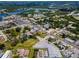Aerial view showcasing a town with various buildings, roads, and surrounding greenery at 124 Athens St, Tarpon Springs, FL 34689