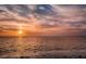Beautiful sunset view over a calm sea, featuring a vibrant and colorful sky at 124 Athens St, Tarpon Springs, FL 34689