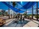 Picturesque town square featuring a statue fountain, seating, and blue canopies at 124 Athens St, Tarpon Springs, FL 34689