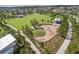Aerial view of a community park with a playground and ample green space at 12420 Rangeland Blvd, Odessa, FL 33556