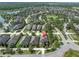 Aerial shot of a home in a community with well-manicured lawns, near green spaces at 12420 Rangeland Blvd, Odessa, FL 33556