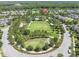 Overhead view of a community park with playground, green space, and walking paths at 12420 Rangeland Blvd, Odessa, FL 33556