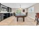Basement with a pool table, custom bar, and entertainment area with plenty of room for fun at 12420 Rangeland Blvd, Odessa, FL 33556