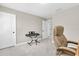 Cozy bedroom with neutral walls featuring an electric piano and an office chair at 12420 Rangeland Blvd, Odessa, FL 33556