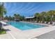 Resort-style community pool with ample lounge seating and shaded areas for relaxation at 12420 Rangeland Blvd, Odessa, FL 33556