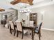 Dining room showcasing a dining table, chairs, a china cabinet, and staircase at 12420 Rangeland Blvd, Odessa, FL 33556