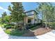 Charming two-story home with manicured landscaping and wrought iron fence at 12420 Rangeland Blvd, Odessa, FL 33556