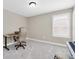 Cozy office with neutral colors, a window for natural light, and a computer at 12420 Rangeland Blvd, Odessa, FL 33556