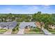 Aerial view of beautiful single Gathering home, landscaped lawn, and tree lined neighborhood at 1245 Overland Dr, Spring Hill, FL 34608