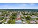 An aerial view of a residential neighborhood with mature trees and well-spaced houses at 1245 Overland Dr, Spring Hill, FL 34608