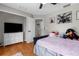 Comfortable bedroom with dresser, TV, and plush bedding at 1245 Overland Dr, Spring Hill, FL 34608