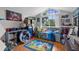 Bright bedroom furnished with a bed, a chair, arcade games and decorated with popular video game characters at 1245 Overland Dr, Spring Hill, FL 34608
