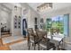 Bright dining room featuring an open floor plan and lovely natural light filtering through the large window at 1245 Overland Dr, Spring Hill, FL 34608