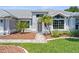 Close-up of a home's front entrance, featuring a decorative door and lush landscaping at 1245 Overland Dr, Spring Hill, FL 34608