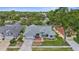 Charming home with well-manicured lawn, mature trees, and a brick driveway enhancing curb appeal at 1245 Overland Dr, Spring Hill, FL 34608