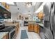 Bright kitchen features granite countertops, stainless steel appliances, and ample cabinet space at 1245 Overland Dr, Spring Hill, FL 34608