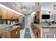 Open concept kitchen with stainless steel appliances, granite countertops and tile floors at 1245 Overland Dr, Spring Hill, FL 34608