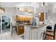 Kitchen with an island, granite countertops, and stainless steel appliances and bar stool seating at 1245 Overland Dr, Spring Hill, FL 34608