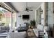 Relaxing screened-in lanai featuring comfortable seating and a cozy fire table at 1245 Overland Dr, Spring Hill, FL 34608