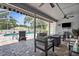 Screened lanai boasts ample seating, a TV, and a view of the pool at 1245 Overland Dr, Spring Hill, FL 34608