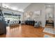 Spacious living room with hardwood floors, sliding doors to the lanai, and stylish coastal decor at 1245 Overland Dr, Spring Hill, FL 34608