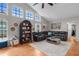 Bright living room with vaulted ceilings, hardwood floors and lots of natural light at 1245 Overland Dr, Spring Hill, FL 34608