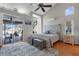 Light bedroom with sliding doors leading to patio and an abundance of natural light at 1245 Overland Dr, Spring Hill, FL 34608