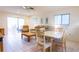 Spacious living area with ceiling fan, tile flooring, furniture and sliding glass doors at 12511 Dearborn Dr, Hudson, FL 34667