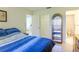 Comfortable bedroom with ample natural light, a closet, and an attached bathroom for added privacy at 12511 Dearborn Dr, Hudson, FL 34667