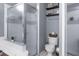 Bathroom featuring glass shower and tiled walls, offering a clean and contemporary design at 13372 Dewey Ct, Spring Hill, FL 34609