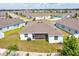 Aerial view of home showing backyard, screened lanai, and neighborhood at 13454 Golden Lime Ave, Spring Hill, FL 34609