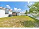 Expansive backyard features a well-maintained lawn with privacy fence at 13454 Golden Lime Ave, Spring Hill, FL 34609