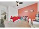 Bright bedroom featuring carpet flooring, fan, and access to an adjacent room, offering versatility at 13454 Golden Lime Ave, Spring Hill, FL 34609
