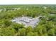 Aerial view of the community boat and RV parking area surrounded by lush greenery at 13454 Golden Lime Ave, Spring Hill, FL 34609