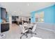 Bright dining area with a table and chairs, seamlessly connected to the modern kitchen and living room at 13454 Golden Lime Ave, Spring Hill, FL 34609