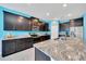Modern kitchen featuring granite countertops, stainless steel appliances, and abundant storage space at 13454 Golden Lime Ave, Spring Hill, FL 34609