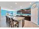 Modern kitchen with granite countertops, stainless steel appliances, and a functional breakfast bar at 13454 Golden Lime Ave, Spring Hill, FL 34609