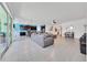 Bright and spacious living room featuring tile floors and open floor plan to kitchen at 13454 Golden Lime Ave, Spring Hill, FL 34609