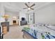 Bright main bedroom featuring a ceiling fan and en-suite bathroom at 13454 Golden Lime Ave, Spring Hill, FL 34609