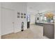 Bright main bedroom featuring tray ceilings and carpeted floors at 13454 Golden Lime Ave, Spring Hill, FL 34609