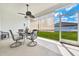 Covered patio offers a comfortable outdoor living space for dining and relaxing at 13454 Golden Lime Ave, Spring Hill, FL 34609